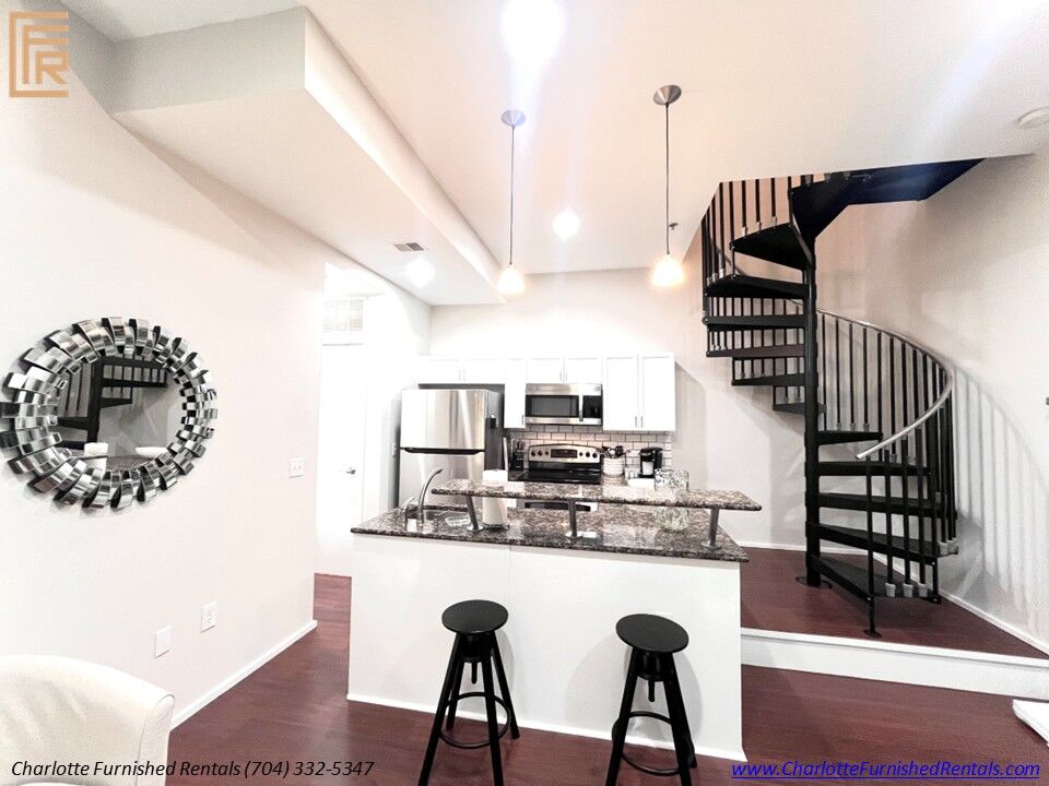 07-2084-euclid-avenue-kitchen-spiral-staircase Kitchen and spiral staircase at 2084 Euclid Avenue furnished rental