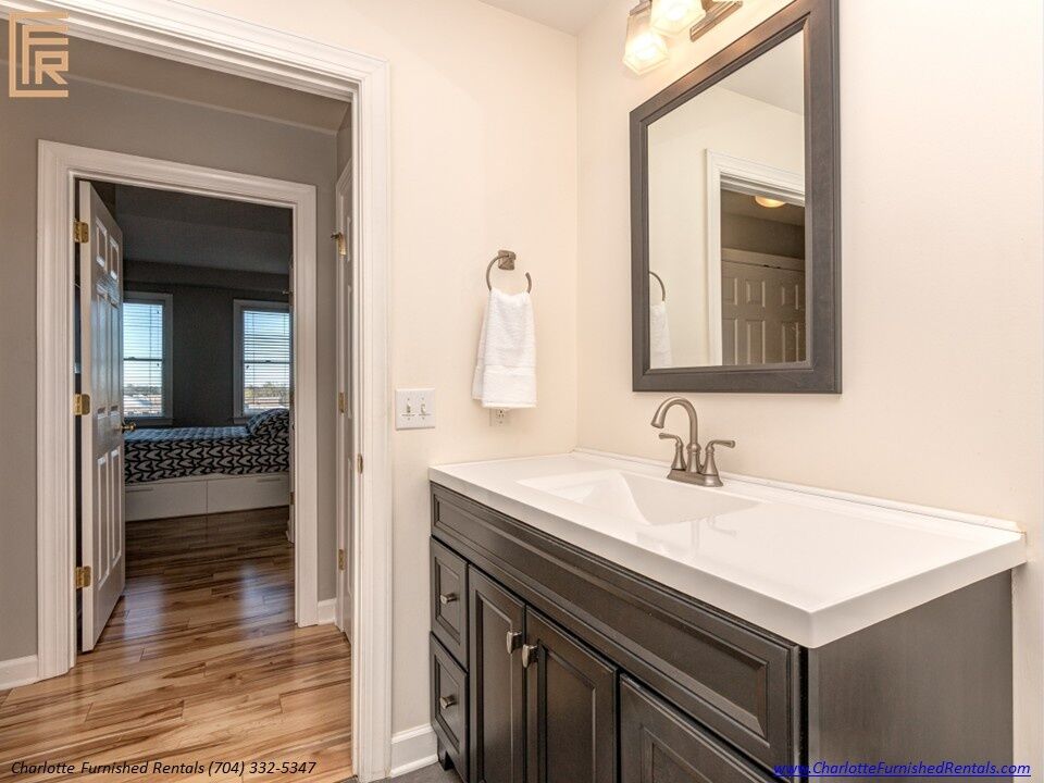 718-west-trade-unit-813-bathroom-vanity-uptown-charlotte Bathroom vanity at 718 West Trade Street Unit 813, a furnished rental in Uptown Charlotte
