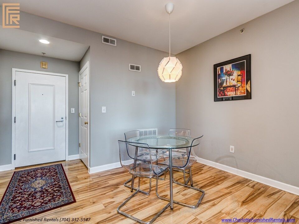 718-west-trade-unit-813-dining-area-uptown-charlotte Dining area at 718 West Trade Street Unit 813, a furnished rental in Uptown Charlotte