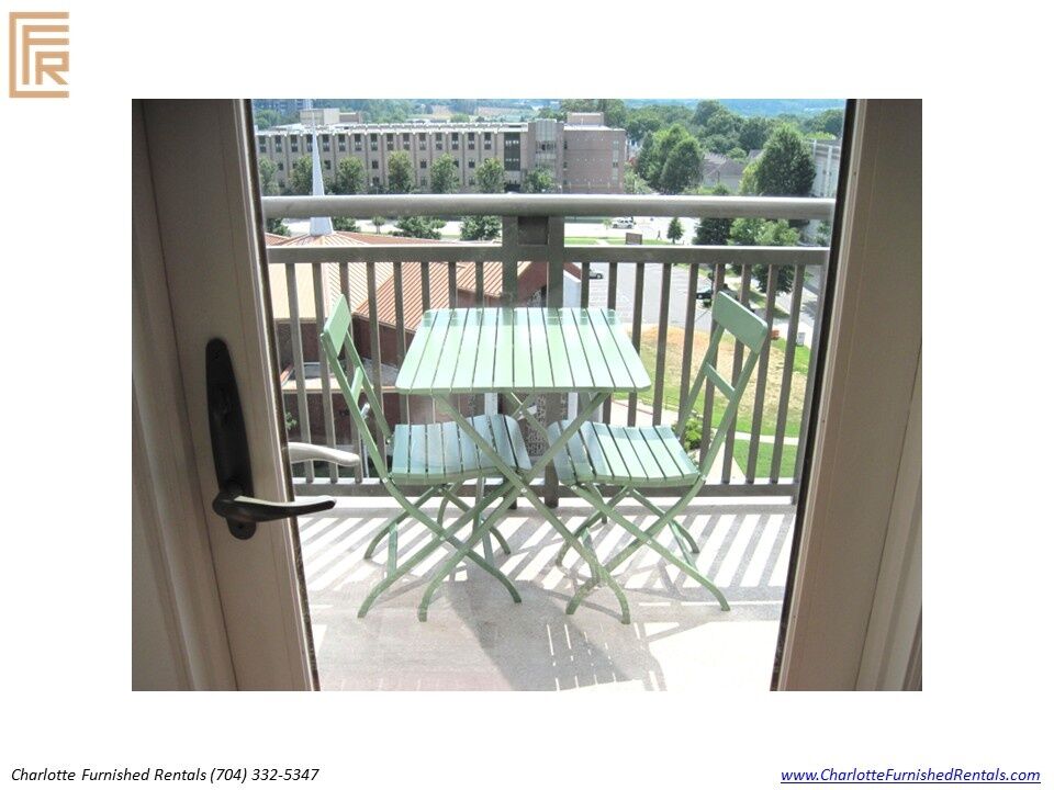 718-west-trade-unit-813-private-balcony-uptown-charlotte Private balcony at 718 West Trade Street Unit 813, a furnished rental in Uptown Charlotte