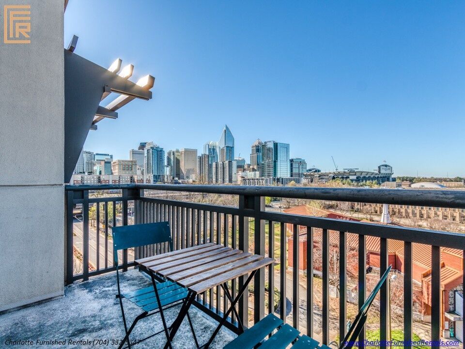 718-west-trade-unit-813-private-balcony-with-uptown-skyline-view-uptown-charlotte-skyline Private balcony with uptown skyline view at 718 West Trade Street Unit 813, a furnished rental in Uptown Charlotte skyline