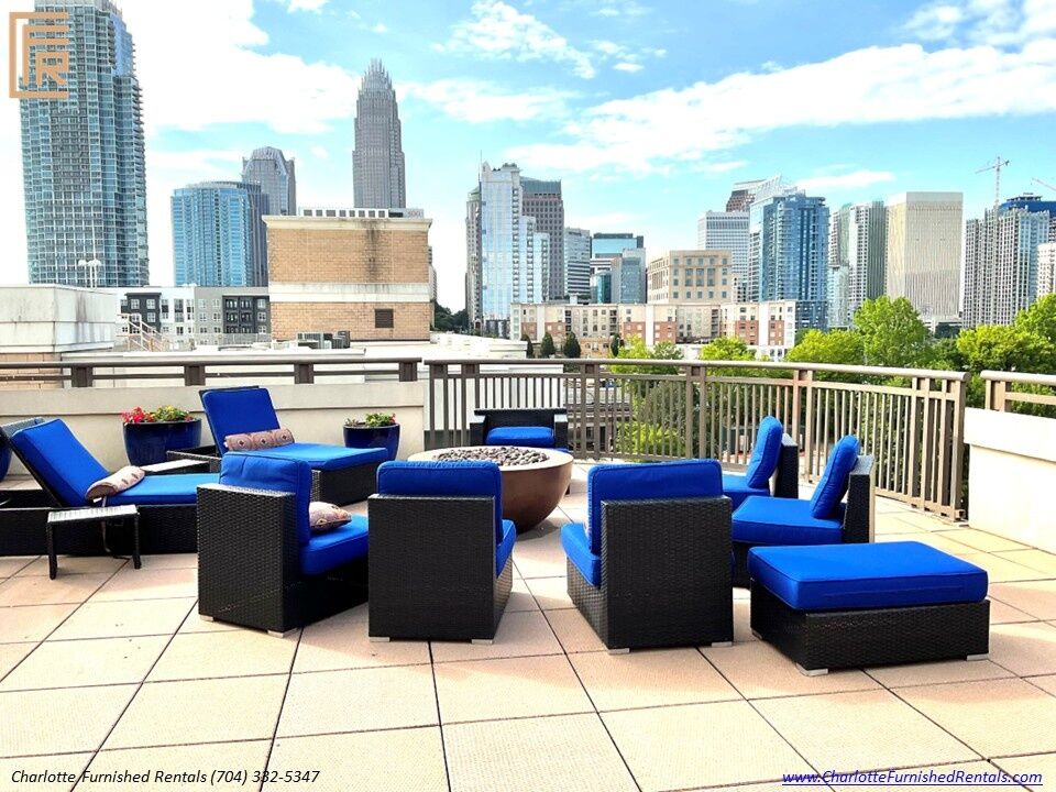 718-west-trade-unit-813-rooftop-terrace-with-uptown-skyline-view-uptown-charlotte-skyline Rooftop terrace with uptown skyline view at 718 West Trade Street Unit 813, a furnished rental in Uptown Charlotte skyline