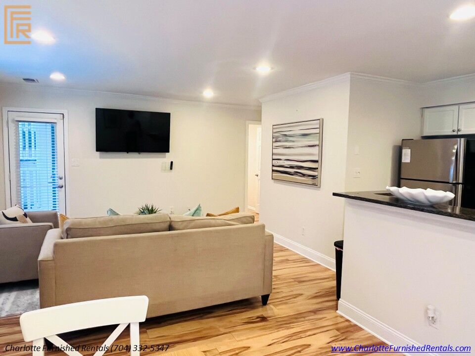 Living Room & Kitchen | 2510 Cranbrook Lane Unit 20 Furnished living room beside kitchen at 2510 Cranbrook Lane Unit 20 Charlotte