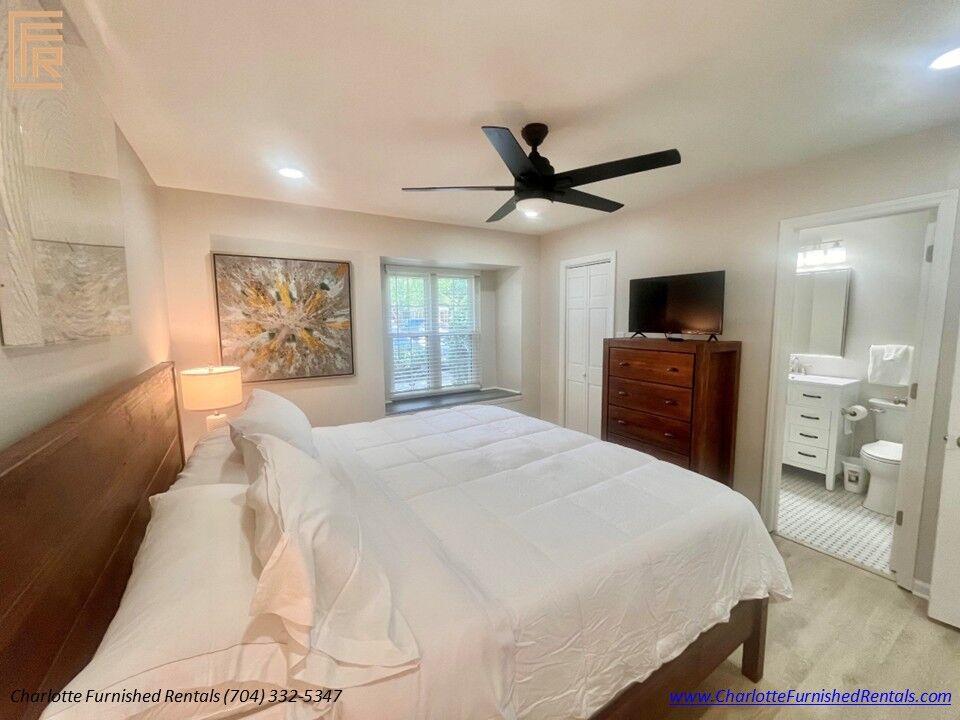 Primary Suite with Private Bathroom Primary bedroom with ensuite bathroom and walk-in closet.