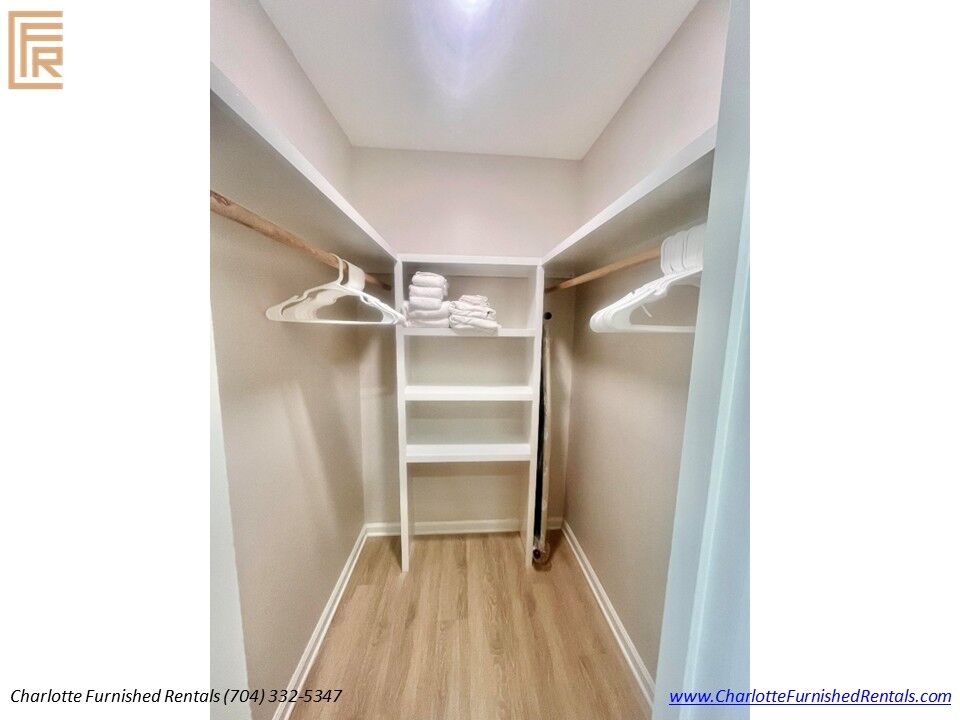 Walk-In Closet Spacious walk-in closet with shelving and hanging storage.