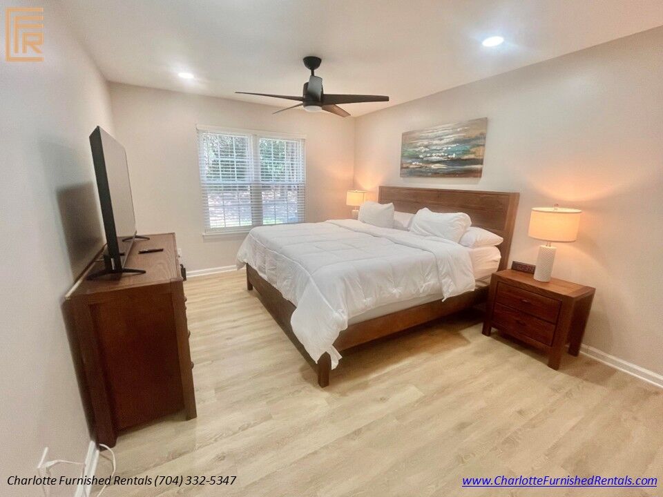Guest Bedroom Alternate View Alternate view of guest bedroom featuring closets and modern furnishings