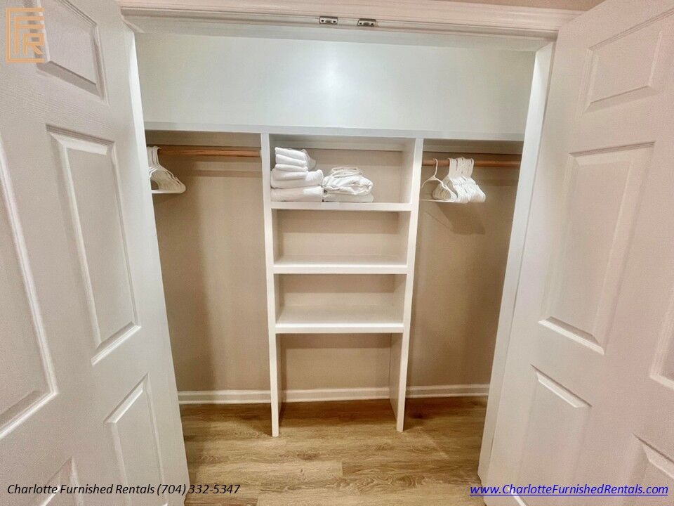 Walk-In Closet Spacious walk-in closet with shelving and hanging storage.