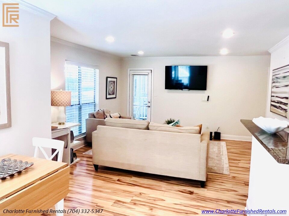 Living Room with Balcony | 2510 Cranbrook Lane Unit 20 Furnished living room with balcony access at 2510 Cranbrook Lane Unit 20 Charlotte NC