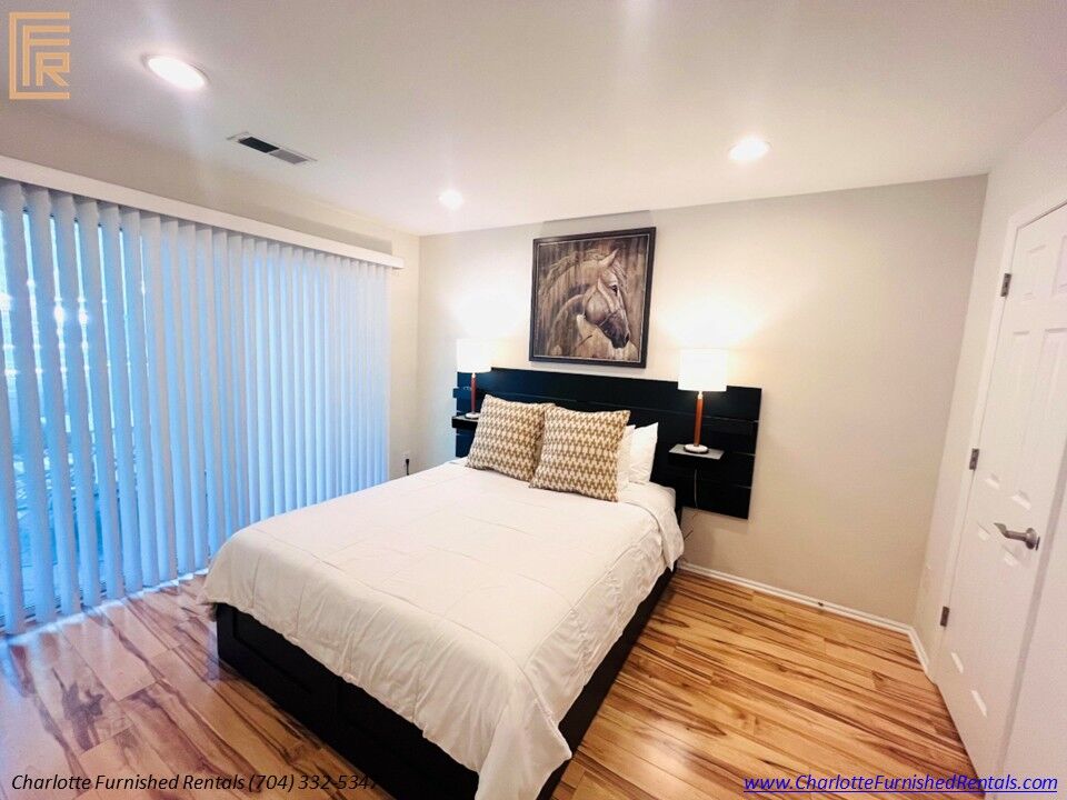 Furnished Bedroom | 2510 Cranbrook Lane Unit 20 Furnished bedroom with queen bed at 2510 Cranbrook Lane Unit 20 Charlotte