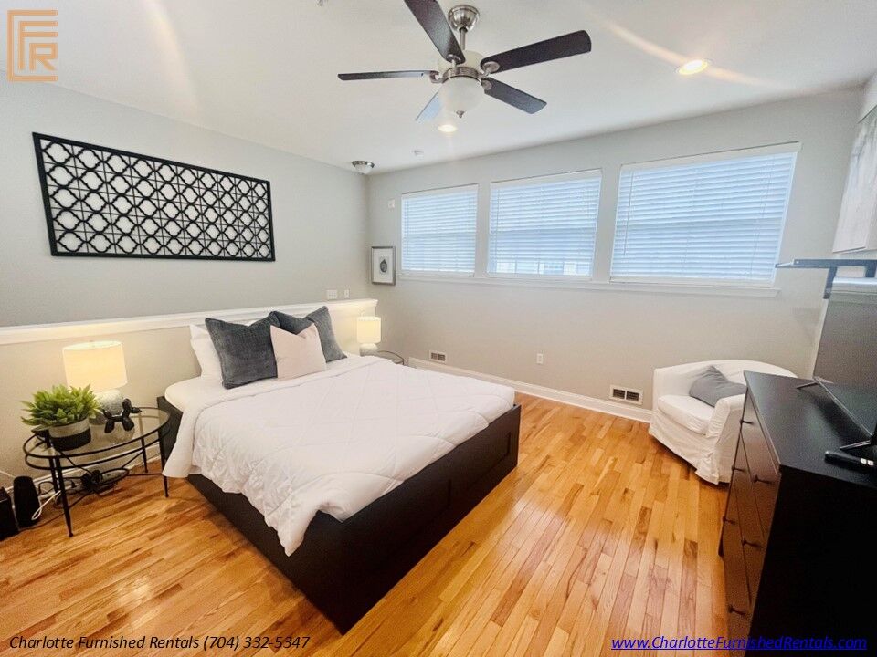 Slide9 Spacious primary bedroom with queen-size bed and premium furnishings. Comfortable bedroom featuring plush bedding and generous natural light. Primary bedroom with large closet and contemporary décor.