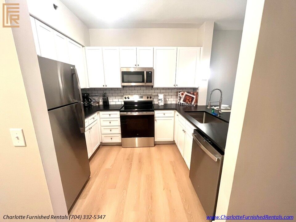 Modern Kitchen Modern kitchen with stainless steel appliances in furnished apartment