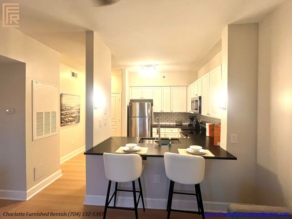 Kitchen and Breakfast Bar Open kitchen with breakfast bar in Dilworth furnished apartment