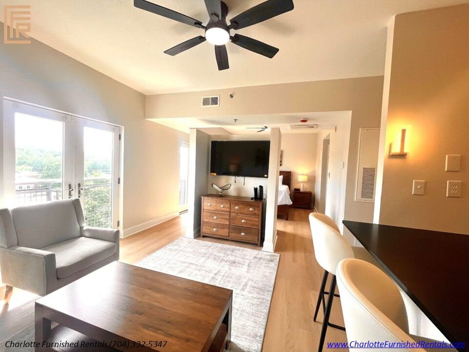 Open Living Area with Fireplace Open-concept living and dining area