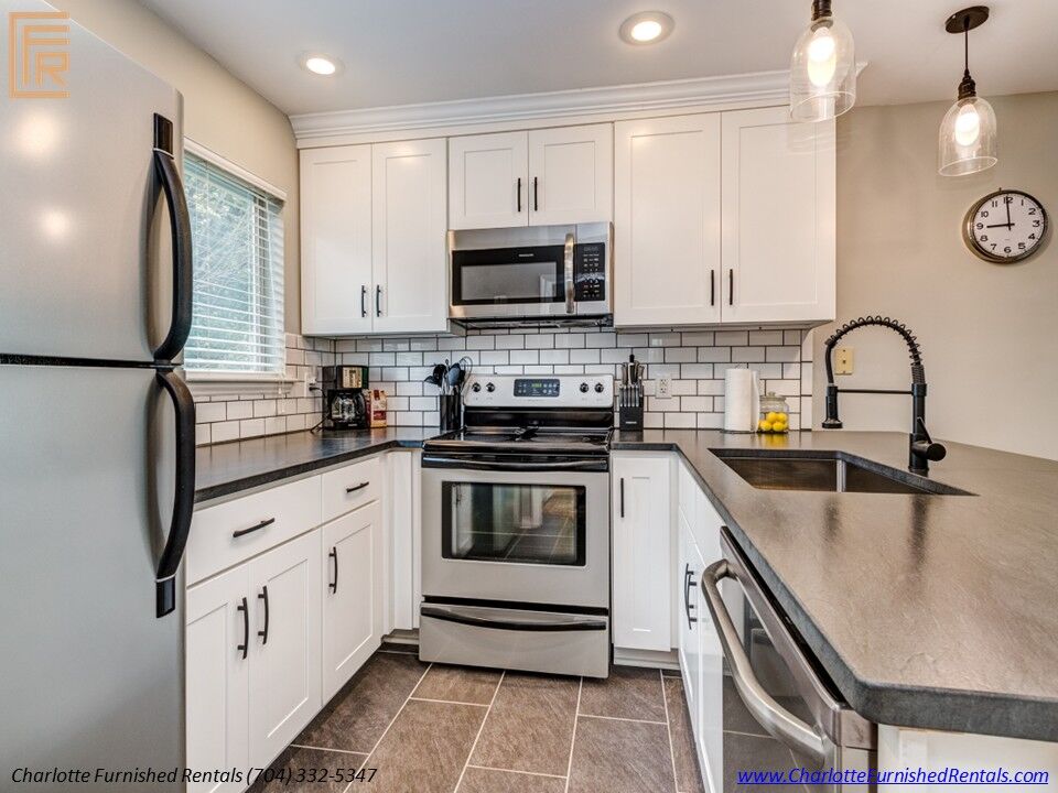 SouthPark furnished rental | open living room and vaulted ceiling SouthPark furnished rental with open living room and vaulted ceiling