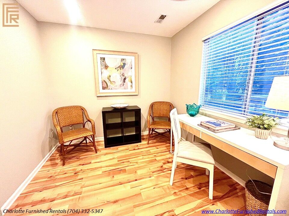 Furnished living room in SouthPark Charlotte | fireplace and television Furnished living room in SouthPark Charlotte with fireplace and television