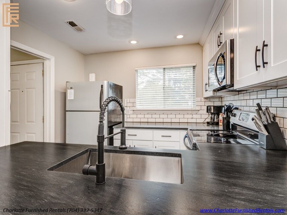 SouthPark furnished apartment living room | private balcony access SouthPark furnished apartment living room with private balcony access