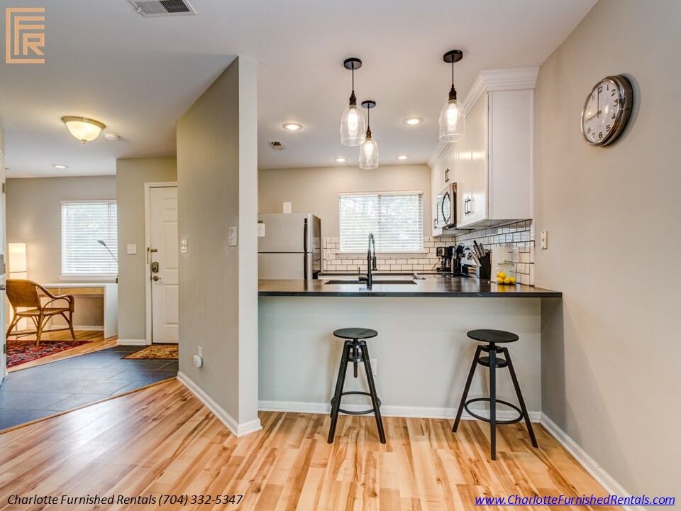 Furnished apartment SouthPark Charlotte | dining area and hardwood floors Furnished apartment SouthPark Charlotte with dining area and hardwood floors