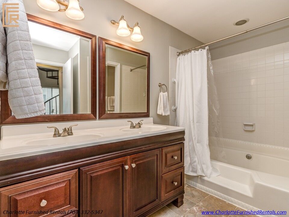 Furnished housing Charlotte NC | full bathroom and vanity Furnished housing Charlotte NC with full bathroom and vanity